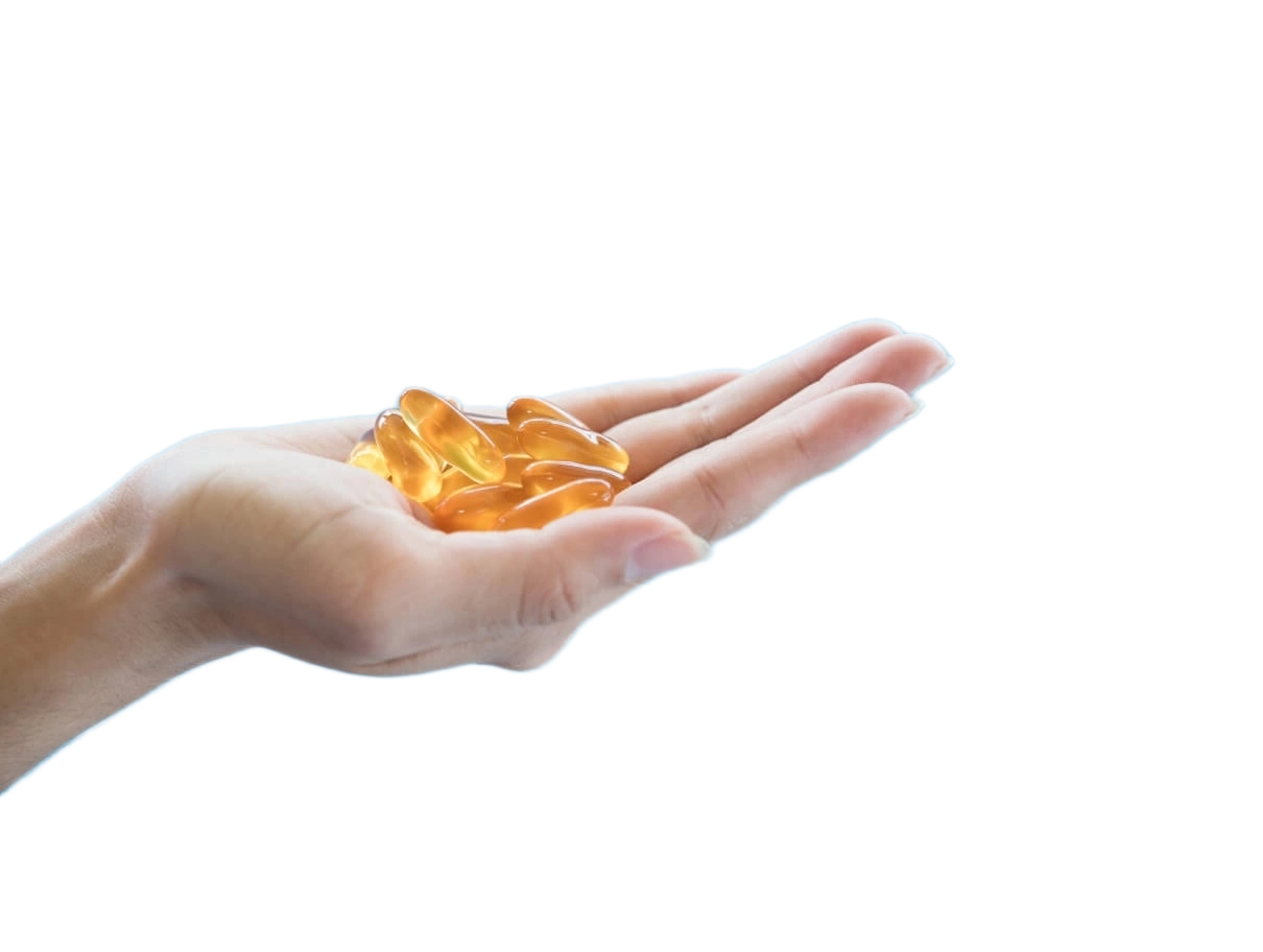 GROWTH SUPPLEMENTS - Imagem Ilustrativa mão segurando cápsulas soft de Ômega-3