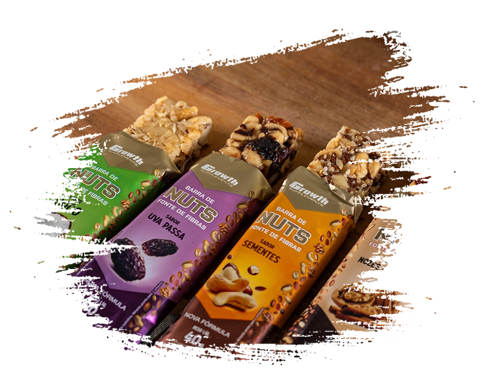 Os 4 sabores de barra de nuts da Growth Supplements em cima de uma tábua