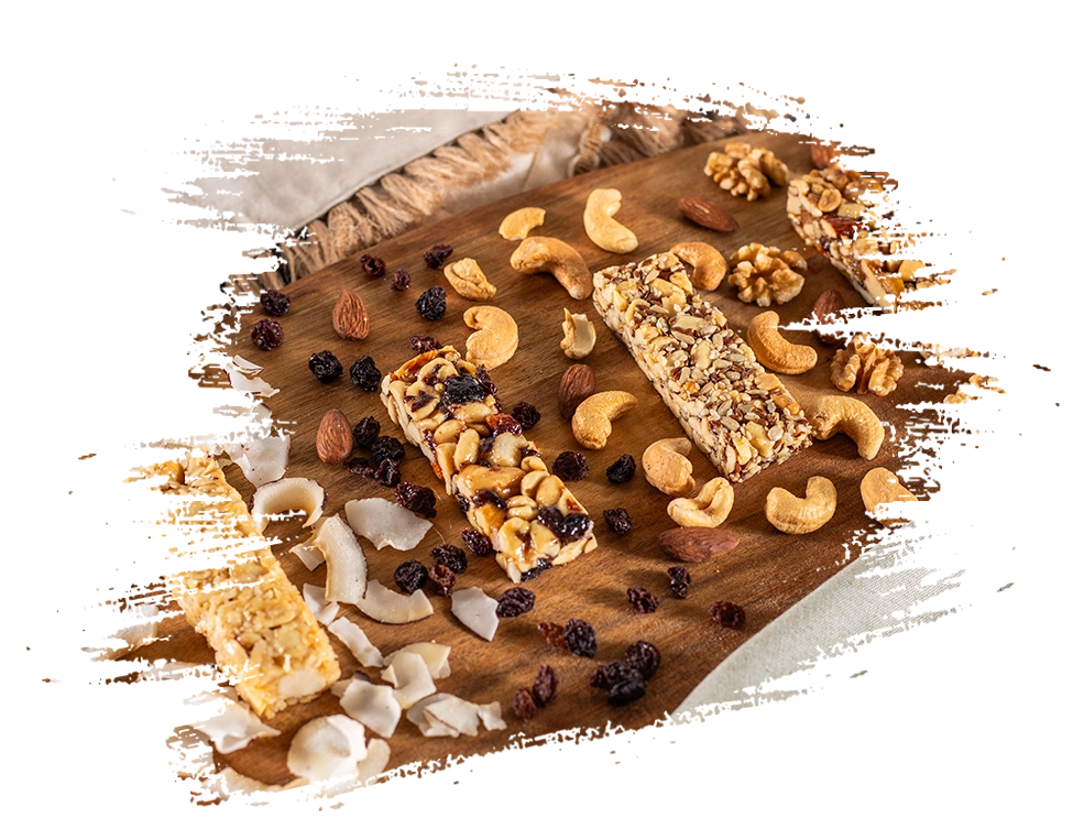 Os 4 sabores de barra de nuts fora da embalagem da Growth Supplements em cima de uma tábua