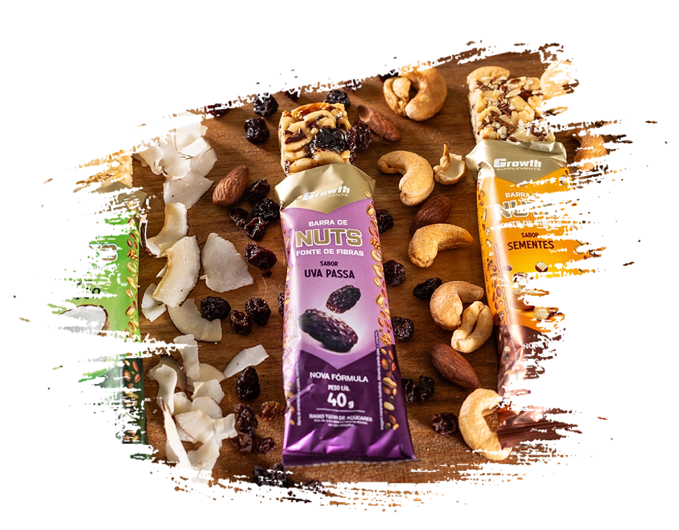 Os 4 sabores de barra de nuts da Growth Supplements em cima de uma tábua